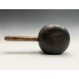 A 19th century treen lignum vitae saddle maker's mallet, length 26cm.