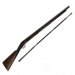 A 19th century single barrel percussion rifle with walnut stock and textured grip with a ramrod, and