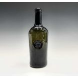 A sealed wine bottle, late 18th/early 19th century, the seal with a C below a crown, height 26.5cm.