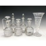 A pair of Stuart crystal glass decanters, height 23cm, together with a matching claret jug and