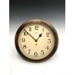 An English Bentima circular oak case wall clock, with Arabic numerals, diameter 37.5cm.