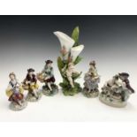 A pair of Sitzendorf porcelain figures with floral encrusted decoration, height 14cm, together
