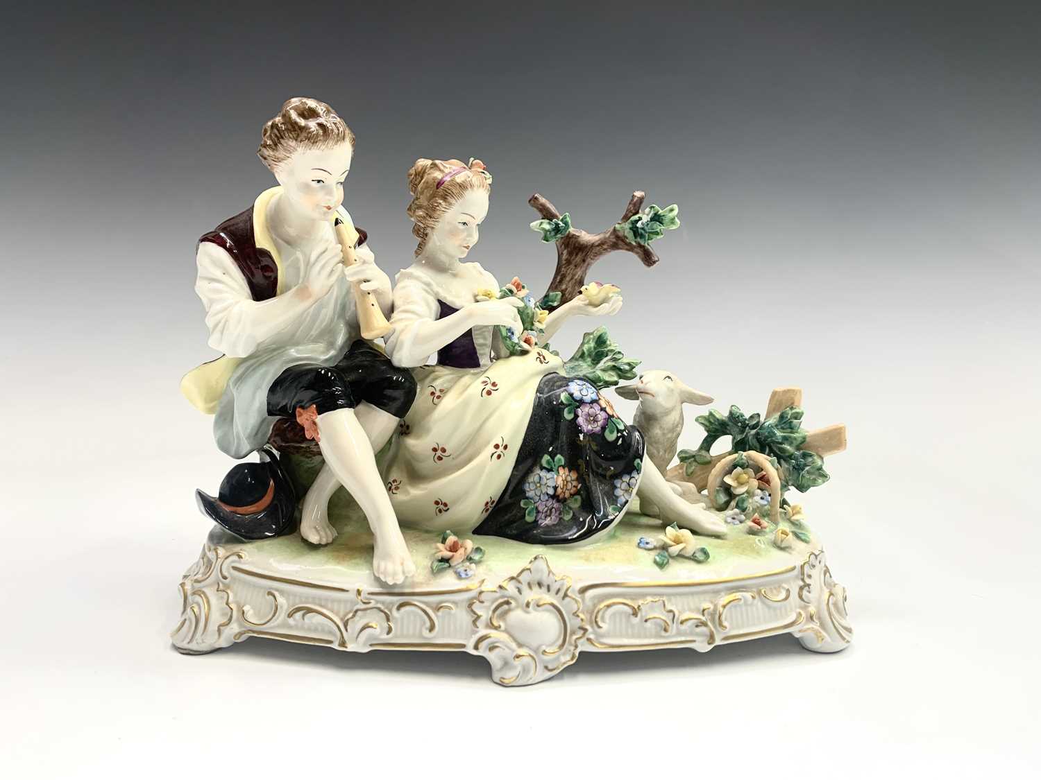 A German porcelain oil lamp base, circa 1900, modelled as a basket supported by three cherubs, - Image 6 of 10