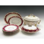 A 19th century Copeland porcelain part dinner service with burgundy and gilt borders, comprising