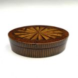 A George III mahogany, crossbanded and satinwood inlaid oval trinket box, with large paterae to