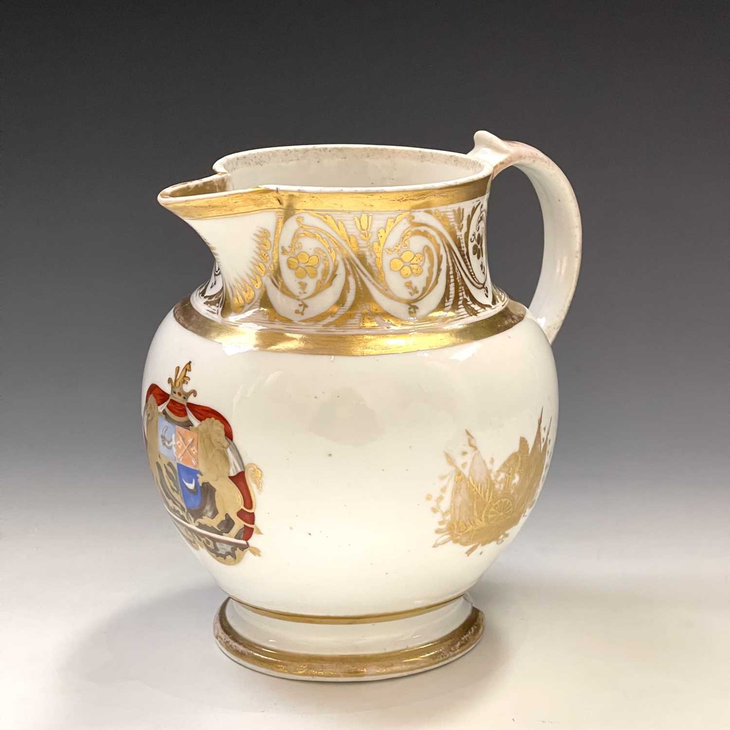 A 19th century porcelain armorial jug highlighted with finely gilt panels below a foliate scroll - Image 5 of 7