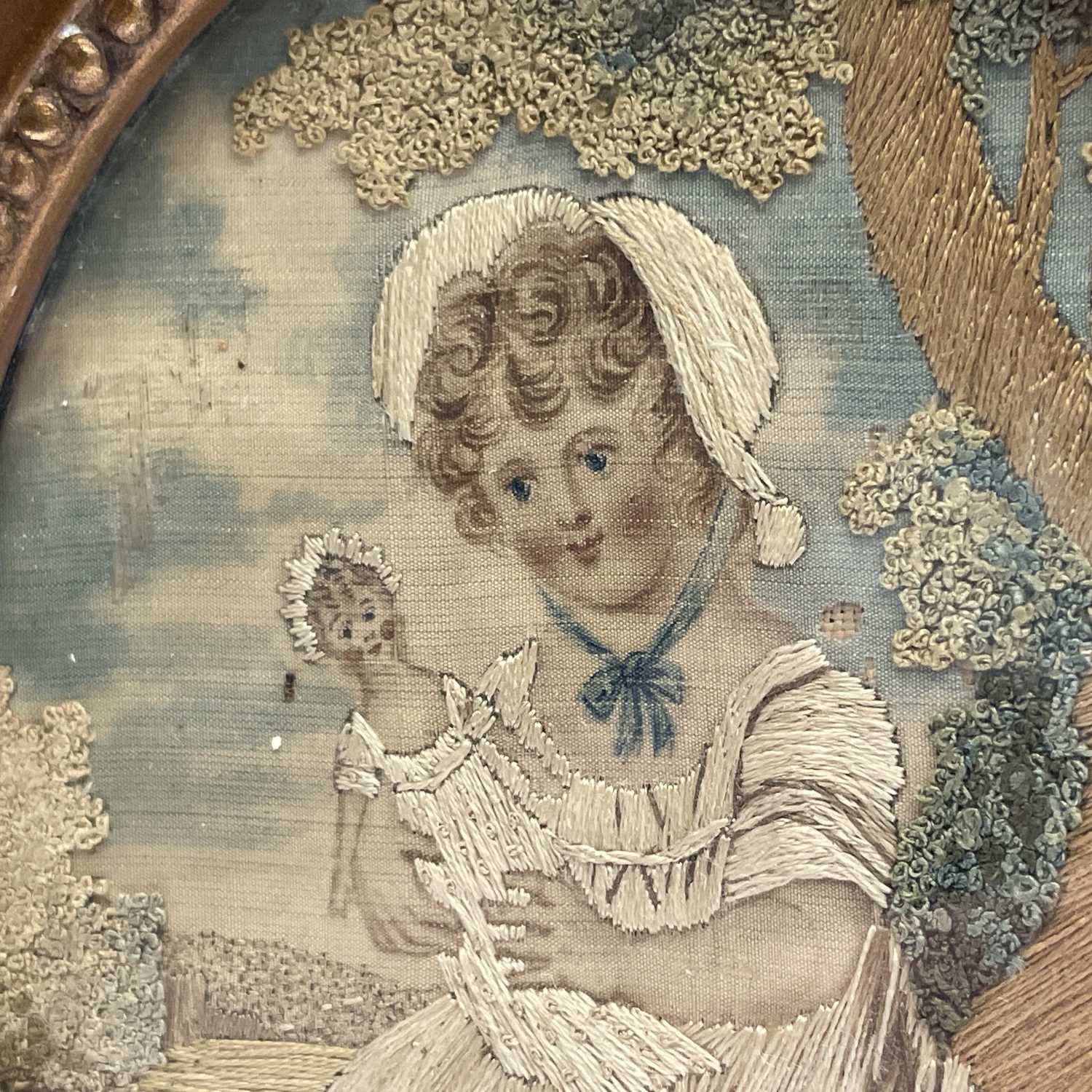 A pair of Regency small oval silk work pictures, with a boy picking fruit and a girl with a doll, - Image 10 of 17