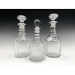 A pair of early Victorian triple ring neck glass decanters and stoppers, height 28cm, together