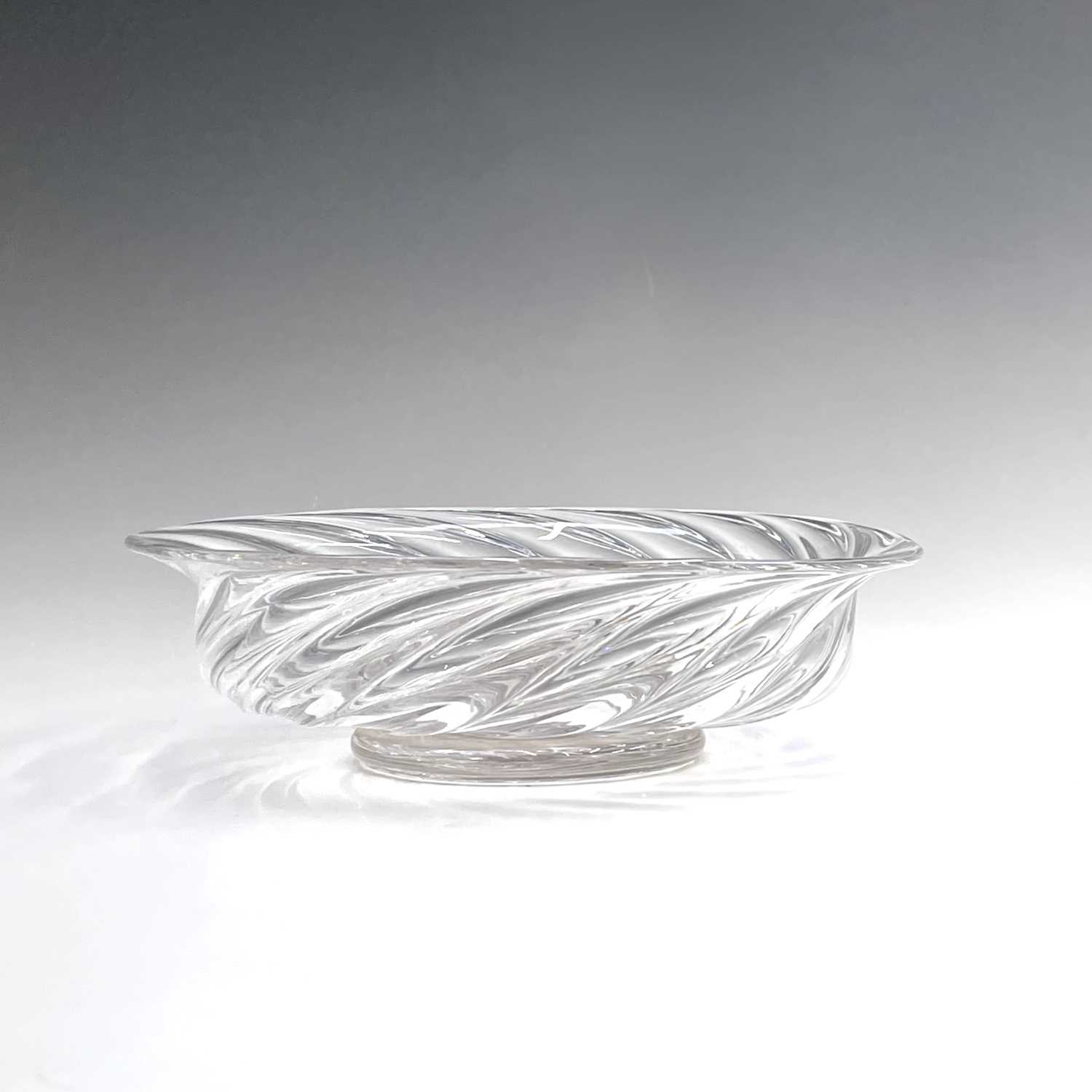 A Georgian glass bowl, of low wrythen form on a pedestal foot, diameter 22cm, height 6.5cm.Condition