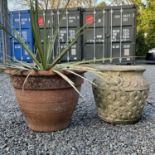 A reconstituted stone planter in the Arts and Crafts style, height 40cm together with a terracotta