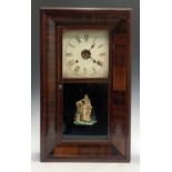 An American Ansonia twin weight mahogany wall clock, 19th century, the door decorated a maiden,