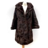 A fine quality fur jacket together with a fur muff, fur stole and a short fur jacket.