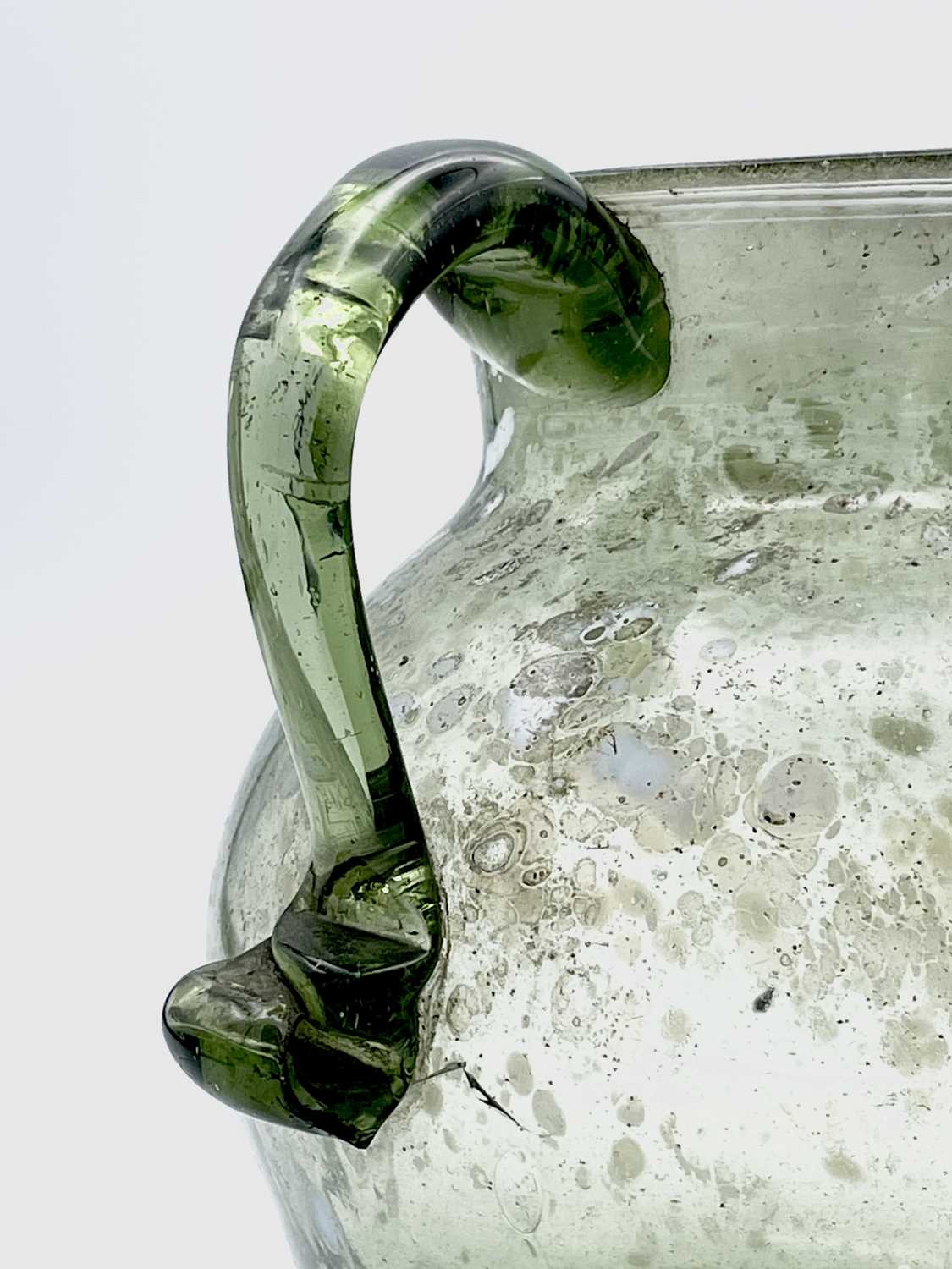 A Nailsea type glass jug, circa 1800, pale green with opaque white mottling, height 15cm.Provenance: - Image 2 of 5
