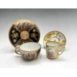 A Meissen cabinet cup and saucer, late 19th century, painted with reserves in the 18th century style