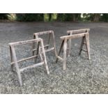 A pair of carpenters trestle saw horses, and a pair of folding trestle saw horses, height 73cm width