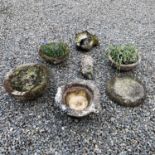 Carved marble mortar probably 18th century together with three cast concrete planters, and two large