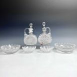 A pair of Victorian cut glass decanters and stoppers, with side handles, height 23cm, together