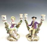 A pair of Meissen figural candelabra, late 19th century, modelled as a lady and a gentleman in