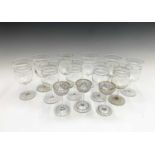 A set of ten Edwardian white wine glasses, the thistle shape bowls with cut bands, height 13cm,