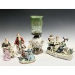 A German porcelain oil lamp base, circa 1900, modelled as a basket supported by three cherubs,