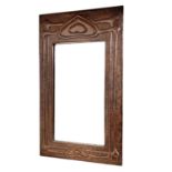 A Glasgow School Arts and Crafts copper framed mirror, circa 1900, embossed with heart motifs and