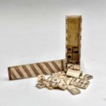A set of Napoleonic bone prisoner of war miniature dominoes, the case with sliding lid and red