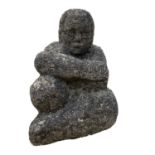 A reconstituted stone seated female form. height 34cm.Provenance: From the Estates of June
