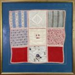 A framed Victorian textile with nine different vintage fabric panels hand stitched together to