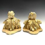 A pair of carved giltwood wall brackets, circa 1900, with acanthas leaf supports, height 23cm, width