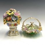 A Stevenson & Hancock Derby porcelain flower urn, with delicately modelled blooms, on a pedestal