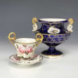 A Nantgarw miniature cabinet cup and saucer with double gryphon handles, applied floral decoration