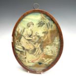 A Regency silk work oval picture of a shepherdess preparing a wreath, with painted detail,