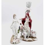 A German porcelain figural candle holder, modelled as a woman beside a brazier, height 21.5cm,