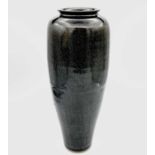 Alan BROUGH A slender baluster studio pottery vase with dark blue mottled glaze Impressed potters