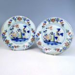 A pair of Lambeth Delft polychrome chinoiserie plates, 18th century, decorated with leaves and