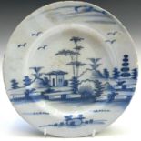 An 18th century English Delft plate, decorated with a landscape scene, diameter 22.5cm.Provenance: