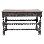 A 17th century carved walnut side table, the rectangular top above a single frieze drawer carved