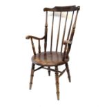 A late 19th century beech wood armchair, height 111cm, width 60cm.repair to one of the arms. Extra