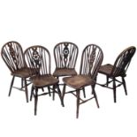 A harlequin set of five 19th century elm and ash Windsor chairs with hoop, stick backs with wheel