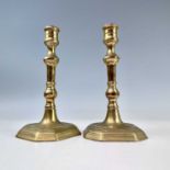 A pair of Georgian brass candlesticks, with octagonal bases, height 20.5cm, width 11cm, depth 10.
