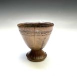 A 19th century carved hardwood goblet, with a carved band beneath the rim, height 10.2cm, diameter