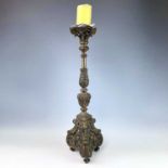 An early-mid 20th century cast brass pricket candlestick, height 62cm.
