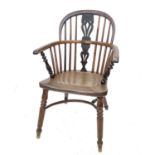 A 19th century elm and yew Windsor chair, with bent wood top-rail and mid-rail with pierced splat