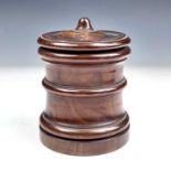 A 19th century yew wood cylindrical jar and cover, height 12cm, diameter 9.5cm.Provenance: Michael