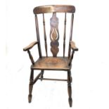 A late 19th century ash and beech Windsor armchair, with blacksmithery ironmongery, height 107cm,