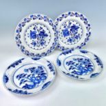 Two pairs of 18th century Delft blue and white plates, each decorated with floral sprays,