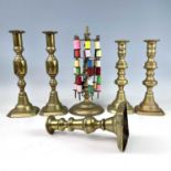 A brass cotton reel stand, circa 1900, height 28cm, two pairs of Victorian brass candlesticks,