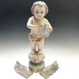A painted carved wood figure of a winged cherub, 20th century, on a circular plinth base, height