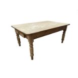 A pine kitchen table, circa 1900, the rectangular top with rounded corners, above a single drawer to