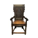 An oak Wainscot armchair, late 17th century, the back with a central carved lozenge motif, solid
